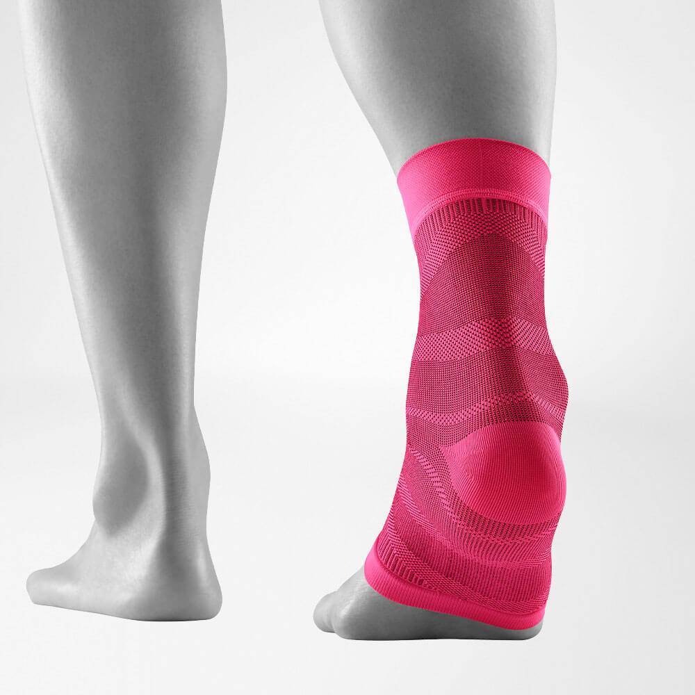 Terugkeeraanzicht van de roze-gekleurde Sportsleeves voor de enkel