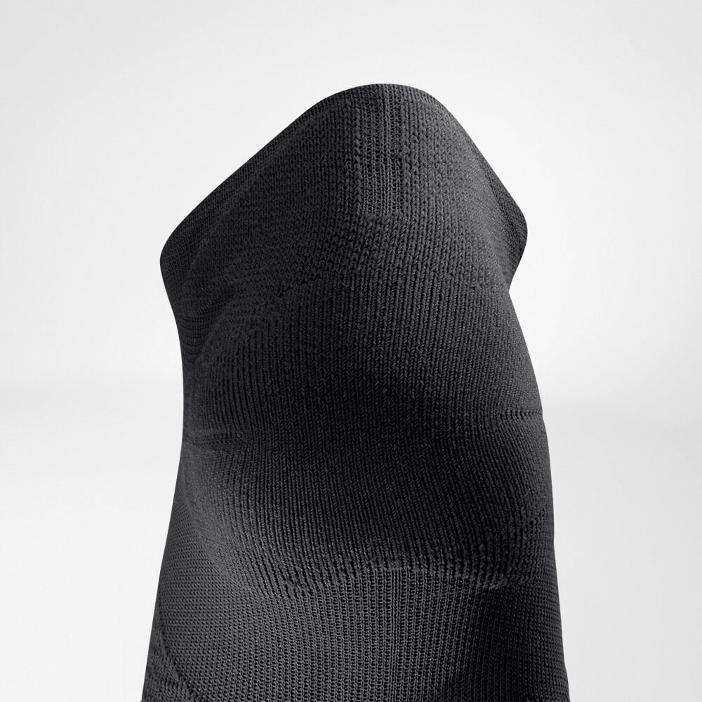 Kurze Sportsocken ultraleicht black Detail Heel Protection Detailansicht des Achillessehnenschutzbereiches der schwarzen kurzen leichten Laufsocke