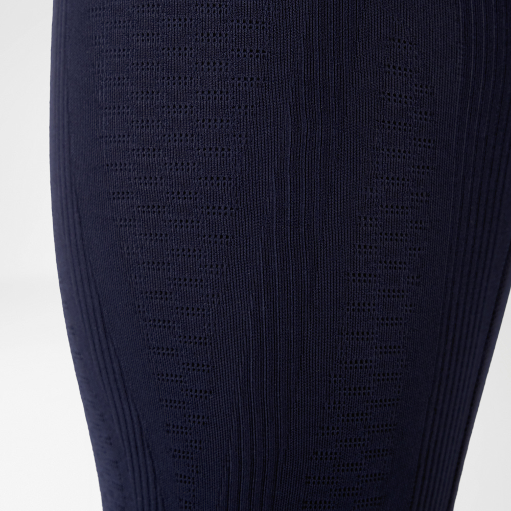 Close-up van compressiebroek met 3D-power dots en gerichte compressietechnologie.